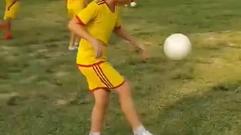 Little Boy Showing Talent As First Steps Brushing Up On Football