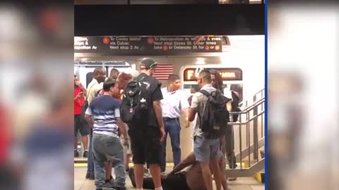 Commuters take down subway thug