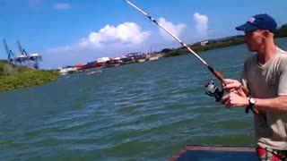 This guy catches a fish with his bare hands!