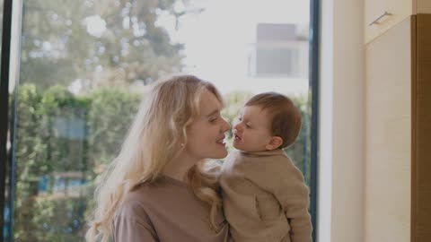 Baby kisses mom