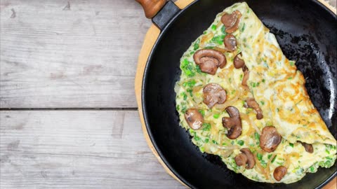 Keto breakfast: omelet with mushrooms and ham