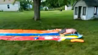 Guy gets knocked out on Slip N' Slide