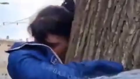 Ukrainian police restrained a girl to a tree, accusing her of theft and branding her as a "thief."