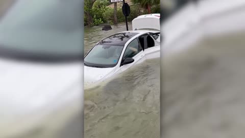 Florida firefighters rescue woman trapped in flooded vehicle in Naples