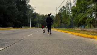 A runner walking with her dog