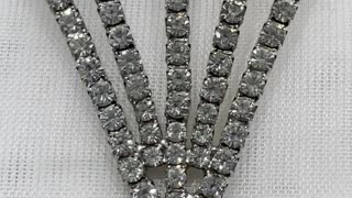 Rhodium Plated 2” x 1.3” Diamond Shape Brooch. Made with Swarovski Crystal