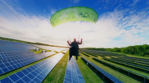 Paramotor Cruising Low Over Solar Farm