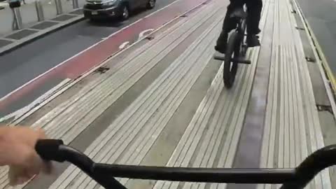 BMX Jump Off a Truck in Traffic
