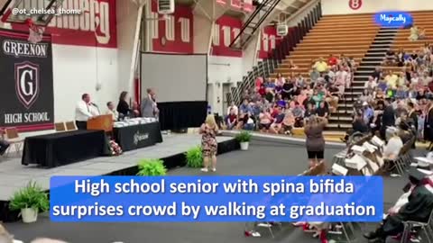 High school senior with spina bifida surprises crowd by walking at graduation