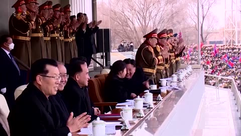 Kim Jong Un and 'beloved child' watch soccer game