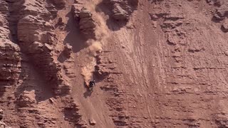 Riding Down A Steep Cliff Face