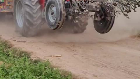 85 Hp Tractor Pulling a Loaded Trolley.