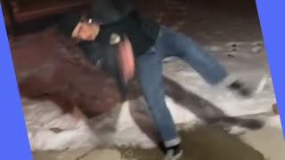 Guy tries his best not to fall on ice