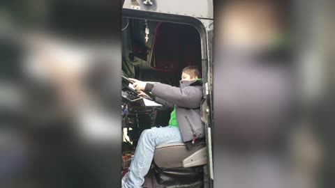 OWNER-OPERATOR SHOWS SON'S SCHOOL FRIEND HIS BIG RIG