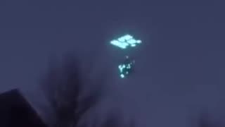 A glowing UFO appears over Russia