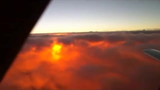 Sun in the clouds from an airplane