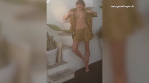 Candice Swanepoel flaunts her toned tummy in a skimpy animal-print bikini