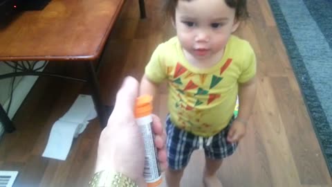 Baby loves to bite and pop M&M bottles! Why?