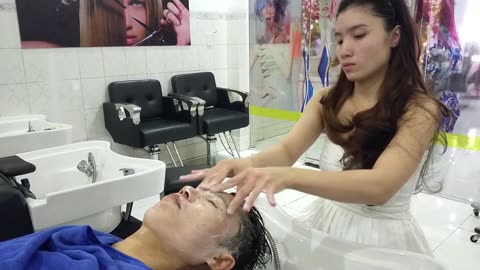 Relaxing shampoo service for a good sleep at Vietnamese barbershop