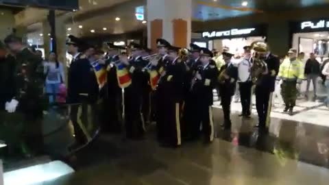 Military band surprises customers in a shopping mall
