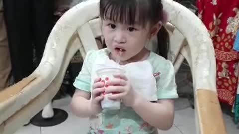 expression of a little girl eating ice cream