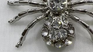 Rhodium Plated 1.75” x 1.25” Spider Brooch. Made with Austrian Crystal