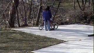 1998 Ashley and Jacqueline Riding a Bike