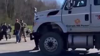 Striking Canadian Public Service workers interfering with traffic are nearly ran over by hydro truck