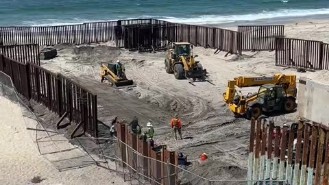 Migrants Run Across Open US-Mexico Border Fence