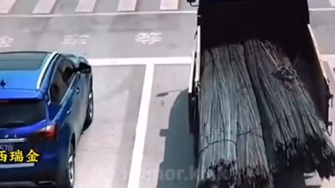 overloaded truck wheel stands at the traffic lights