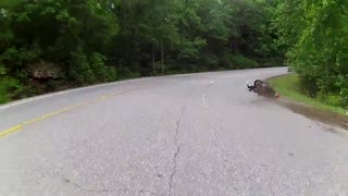 Motorcycle rider loses control during tight turn