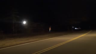 A Nighttime Parallax Shot Of A CSX Work Train Long Hood Forward In Stanley NC 2-13-22