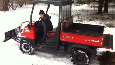 Daniel dumping manure with the Kubota RTV900