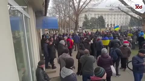 Ukrainians Wave Flags At Protest In City Seized By Russian Forces