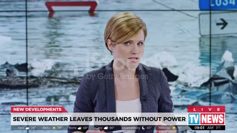 Female anchor presenting breaking news about severe weather causing power outage stock video