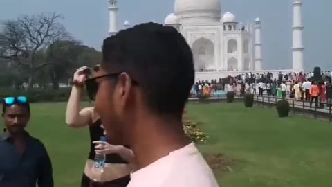 India Men Take Pictures With White Tourist