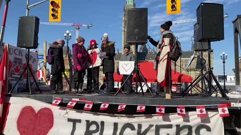 Kids sing O Canada at Parliament Hill as the day kicks off