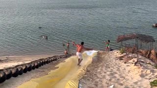 Man Surfs Down Waterslide and Somersaults Into