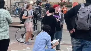 Demonic Leftists Scream at Conservative Reading Holy Bible, Protester Steals His Bible, Rips it Up and Eats Pages