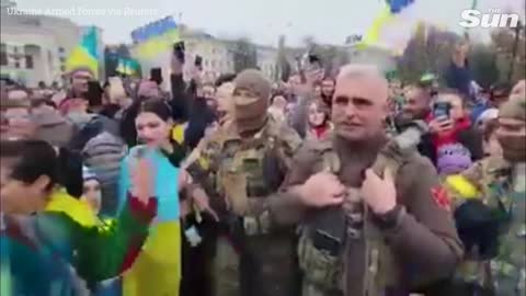 Ukrainian soldier and residents celebrate Russian withdrawal from Kherson