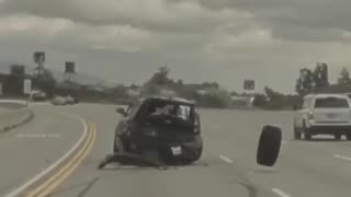 A car was sent flying through the air after being struck by a tire
