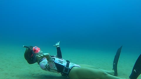 Girl Does a Bubble Ring From 10 Meters Down in the Sea