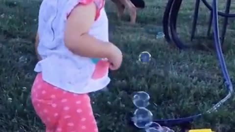 Happy Small Cute Child With Playing Bubble Ball Machine