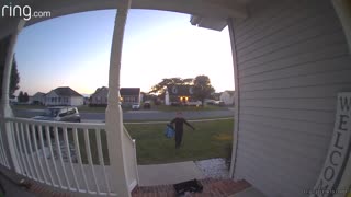 Trick-or-Treater Adds Candy to Empty Bowl