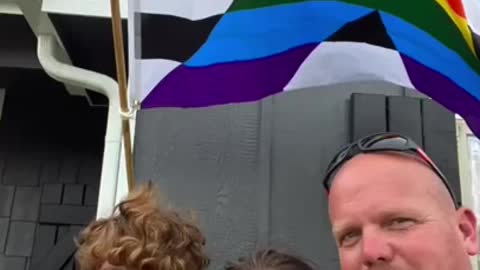 Father And Son Duo Fixes Pride Ally Flag Outside Their House To Show Support