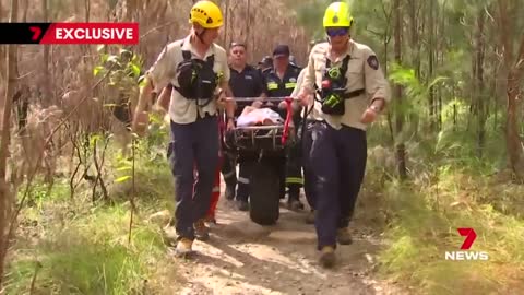 Emergency crews scale Mount Tibrogargan to rescue injured climber