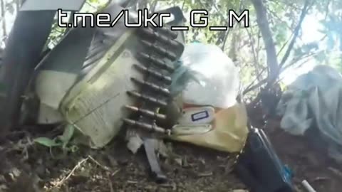 A Ukrainian machine gunner is prevented from raising his head by a Russian sniper