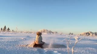 Girl Playing in Deep Snow in Russia
