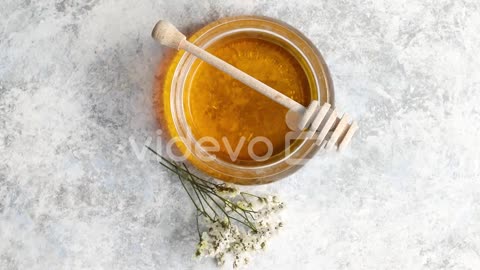 Bowl of honey with spindle