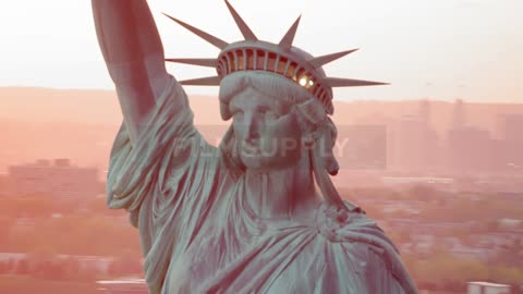 The statue of liberty with the city in the background